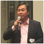 man in suit speaking