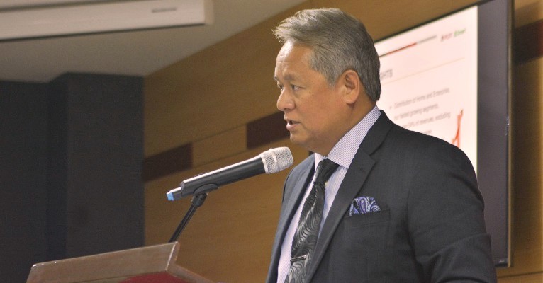 speaker in suit