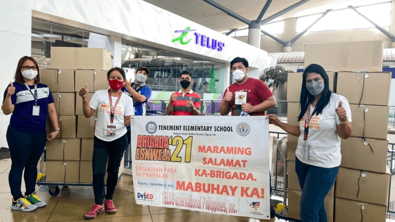 Telus PH employees volunteer to gift Brigada Eskwela kits